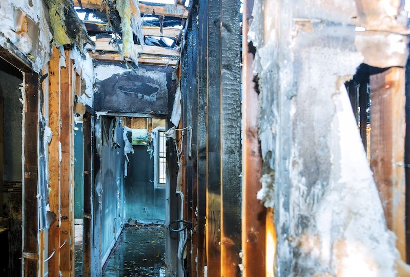 Burnt black house after fire damaged interior details arson from a home