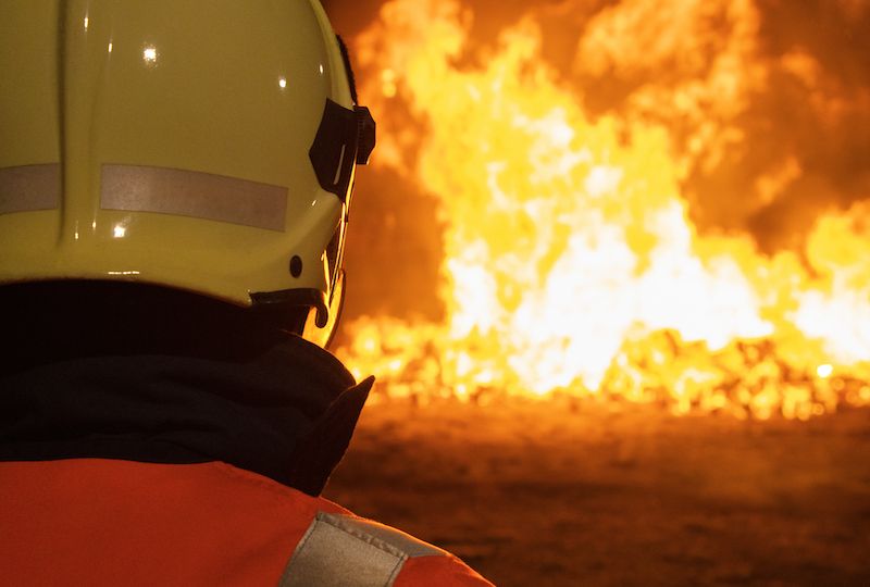 Firefighters putting out a fire. Destruction and disaster